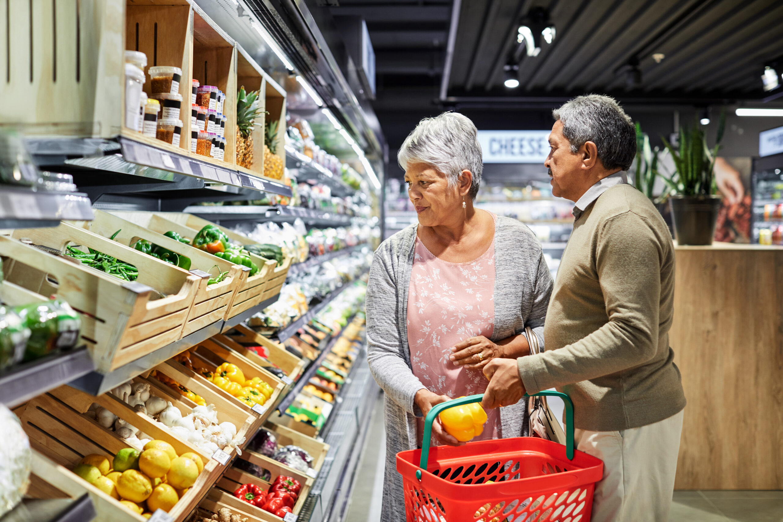 Shot of a elderly couple grocery shopping in a supermarket